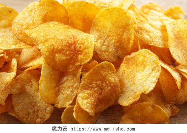 油炸食品黄色土豆片薯片背景图片
